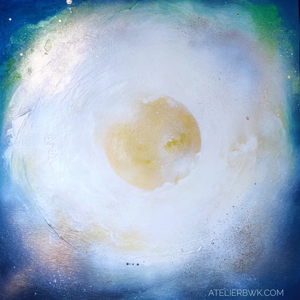 A white and gold nebula in motion.